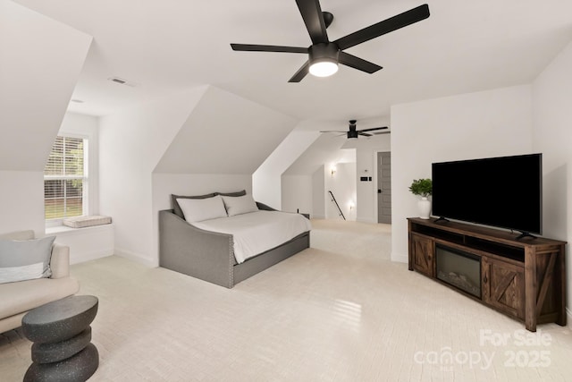 bedroom with light carpet, visible vents, baseboards, and ceiling fan