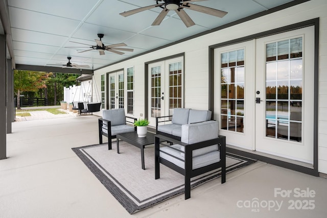 view of patio / terrace with a ceiling fan, french doors, fence, and outdoor lounge area