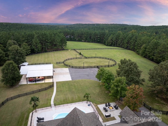 aerial view featuring a wooded view