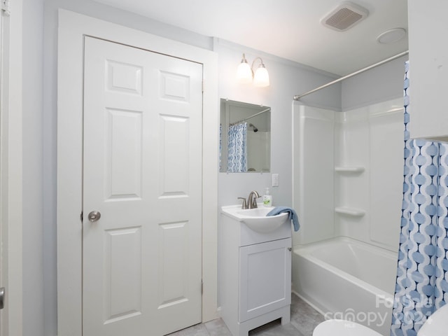 full bathroom featuring vanity, toilet, tile patterned floors, and shower / bath combo with shower curtain