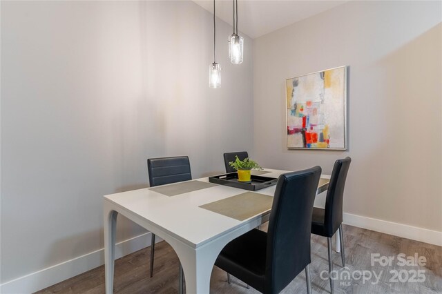 dining room with hardwood / wood-style floors