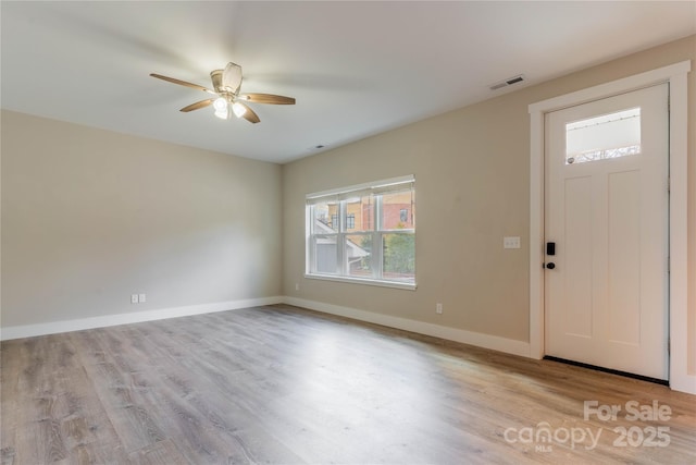 entryway with light hardwood / wood-style floors and ceiling fan