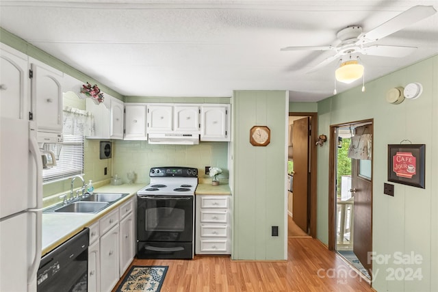 kitchen featuring white appliances, sink, ceiling fan, light wood-type flooring, and white cabinets