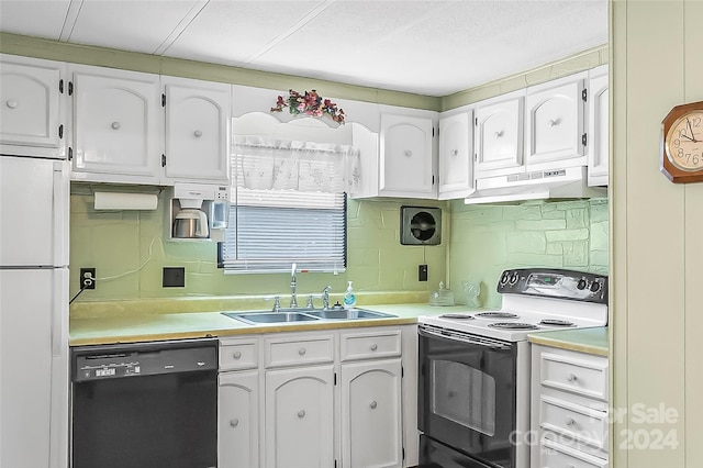 kitchen with backsplash, sink, white appliances, and white cabinetry