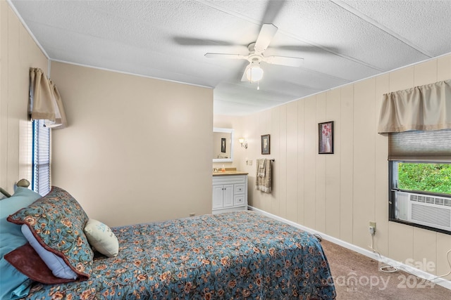 bedroom with ceiling fan, connected bathroom, and carpet