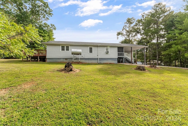 back of property featuring a yard