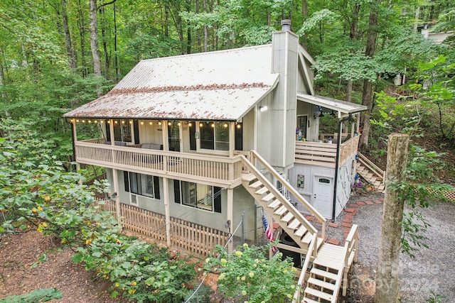 view of front of house featuring a balcony