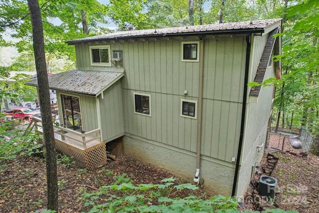 view of side of home with cooling unit