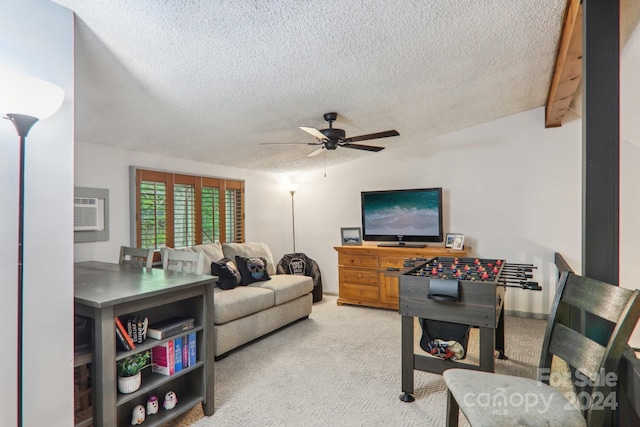 carpeted living room featuring lofted ceiling, ceiling fan, a wall unit AC, and a textured ceiling