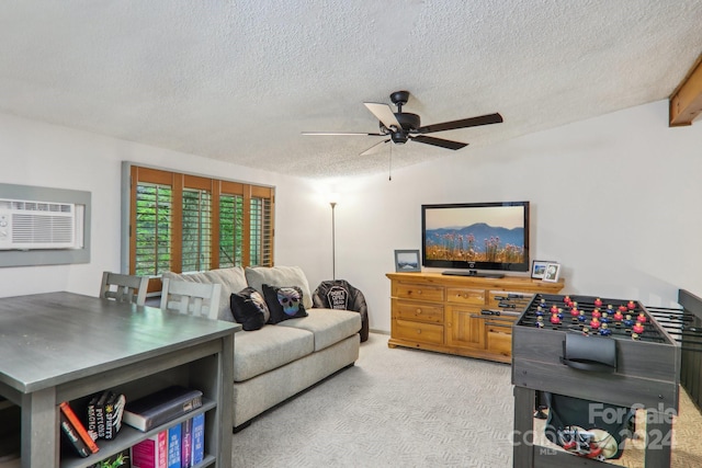 carpeted living room featuring a textured ceiling, ceiling fan, and a wall mounted air conditioner