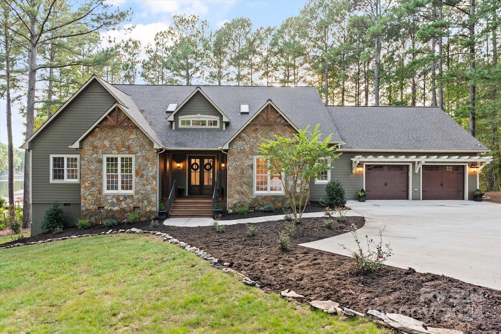 view of front of home featuring a garage and a front yard