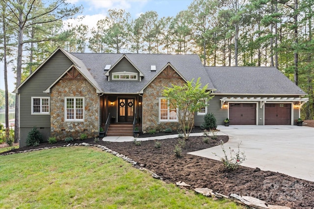 view of front of home featuring a garage and a front yard