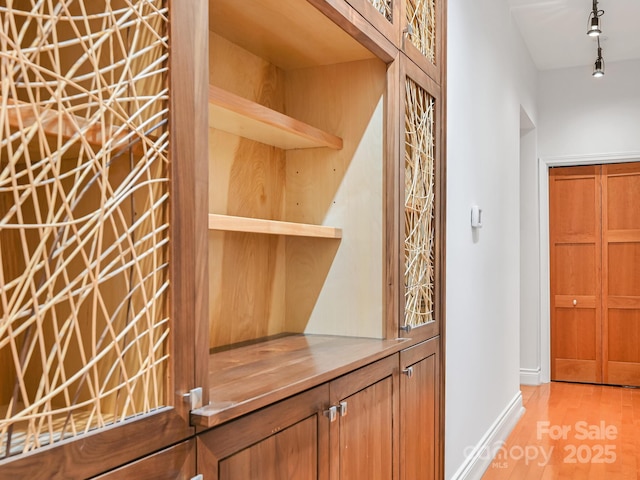 details with wood finished floors and baseboards