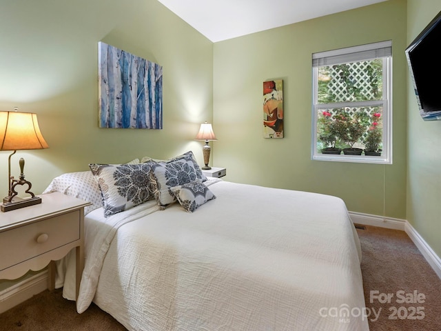 bedroom featuring carpet floors and baseboards