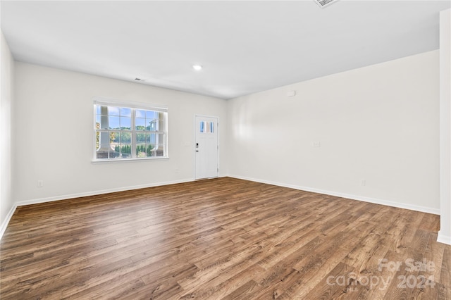 empty room featuring hardwood / wood-style flooring