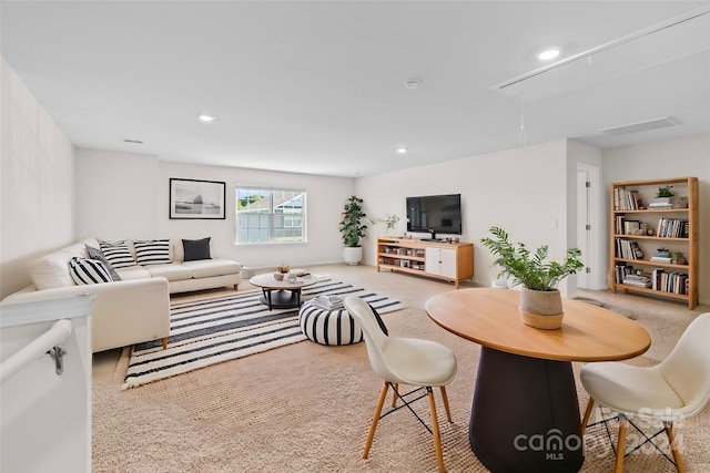 living room with light colored carpet