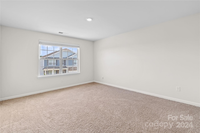 unfurnished room featuring carpet floors