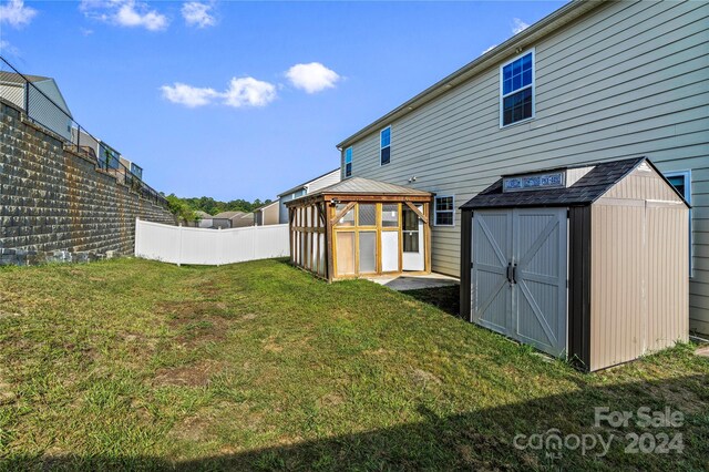 view of yard featuring a shed and a gazebo