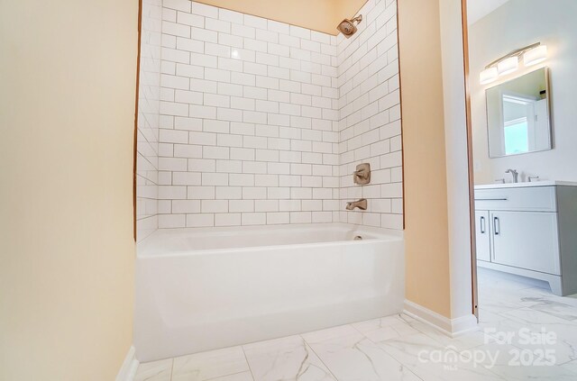 full bathroom with baseboards, marble finish floor, bathtub / shower combination, and vanity