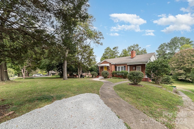 ranch-style home with a front yard