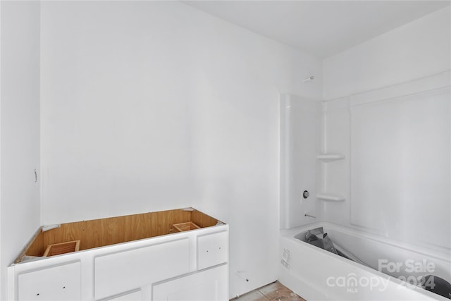 bathroom featuring tile patterned floors and shower / washtub combination