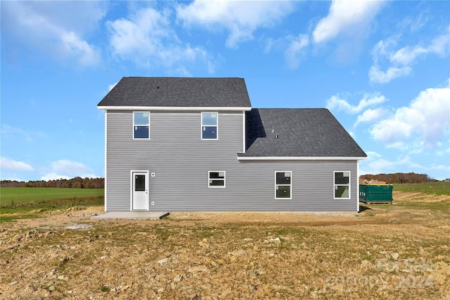 rear view of house with a patio area and a yard