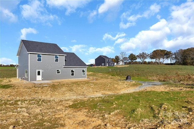 rear view of property with a patio area and a lawn