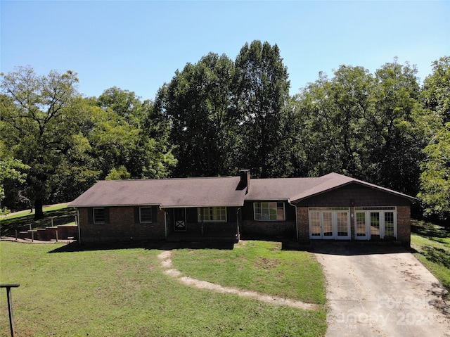 ranch-style home with a front lawn