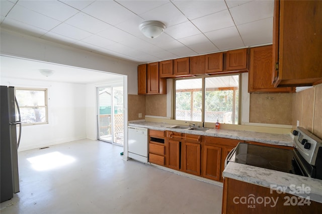 kitchen featuring stainless steel appliances, sink, and a wealth of natural light