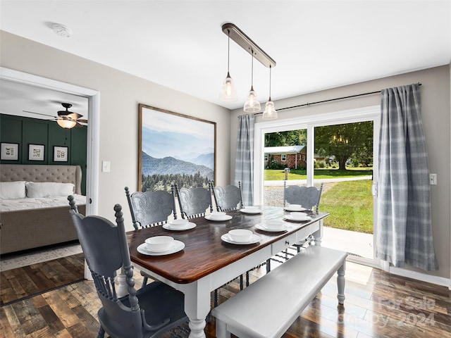 dining space featuring ceiling fan and dark hardwood / wood-style floors