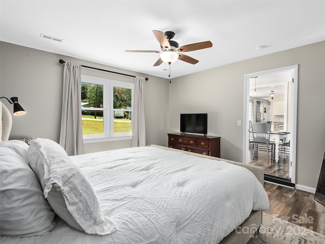 bedroom featuring dark wood-type flooring and ceiling fan