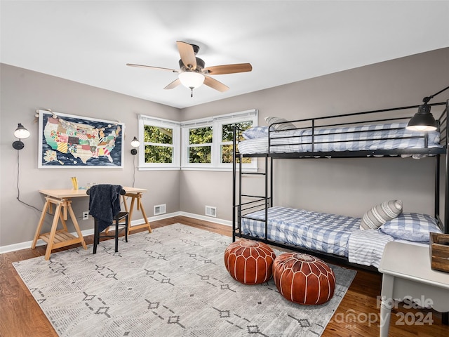 bedroom featuring ceiling fan and hardwood / wood-style flooring