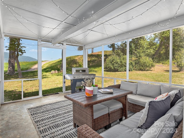 sunroom with a mountain view