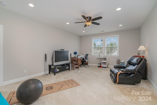 interior space with carpet floors and ceiling fan