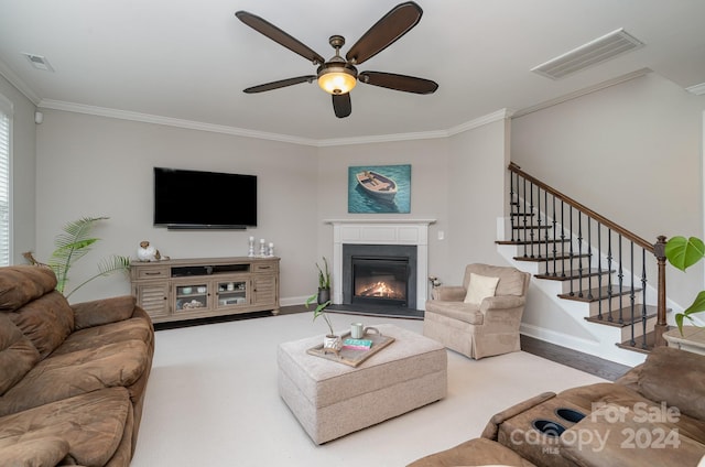 living room featuring ornamental molding and ceiling fan