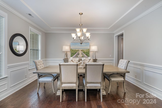 dining room with ornamental molding, a chandelier, and dark wood-type flooring