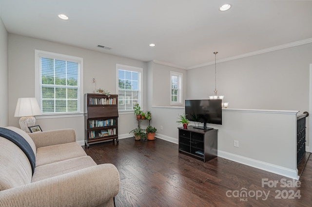 living room with ornamental molding and dark wood-type flooring