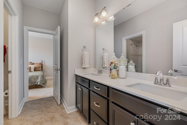 bathroom with vanity and a shower