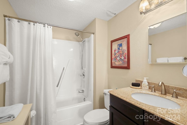 full bathroom with shower / bath combo, toilet, a textured ceiling, and vanity