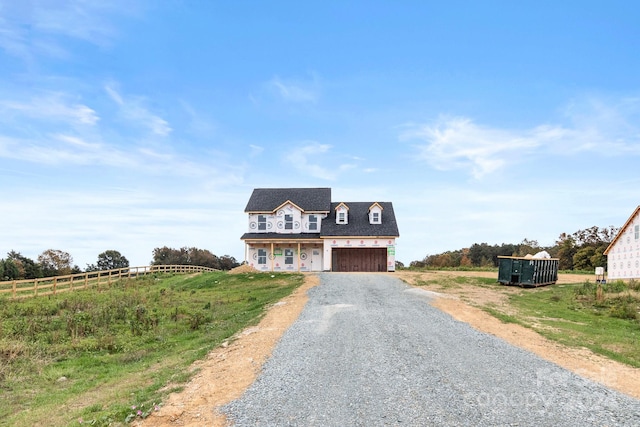 cape cod home with a rural view