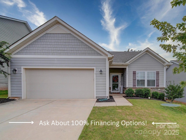 view of front of property with stone siding, driveway, a front yard, and an attached garage