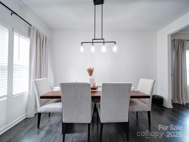 dining space featuring dark hardwood / wood-style floors and a wealth of natural light