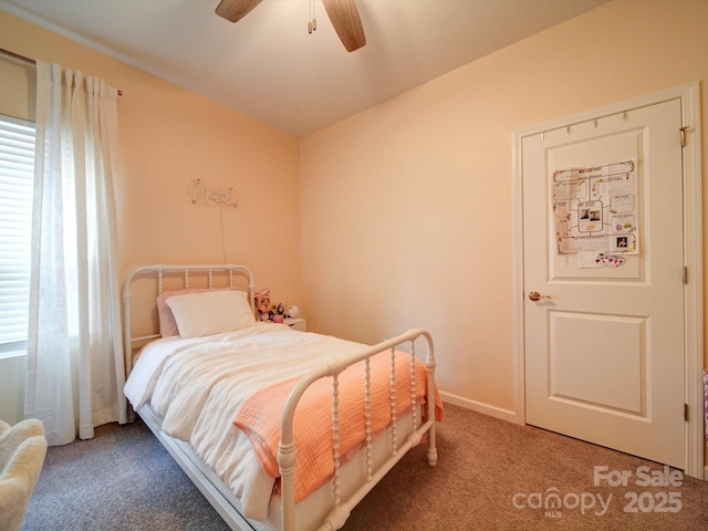 carpeted bedroom featuring ceiling fan