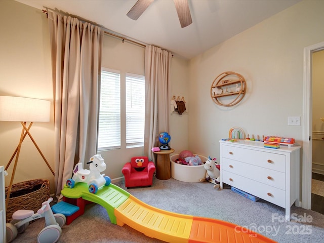 recreation room with carpet and ceiling fan