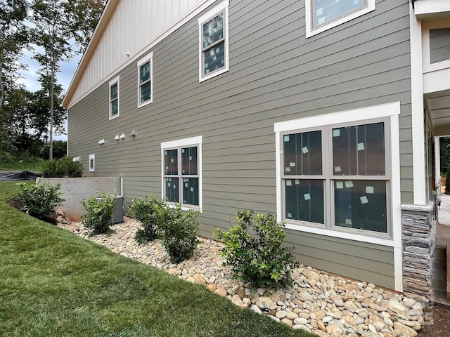 view of home's exterior featuring a yard