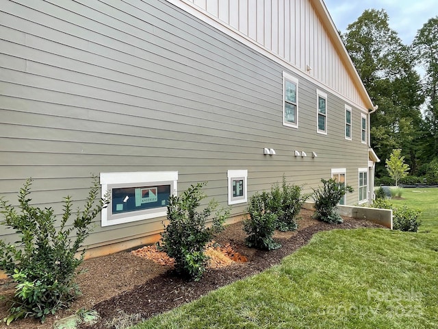 view of home's exterior with a yard