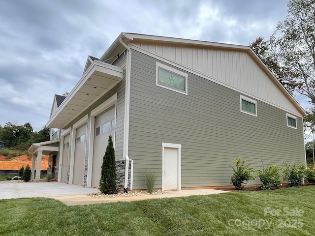 view of property exterior featuring a garage and a yard