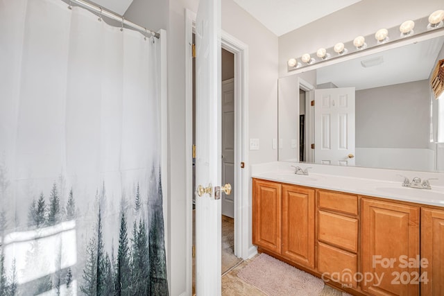 bathroom with vanity and tile patterned flooring