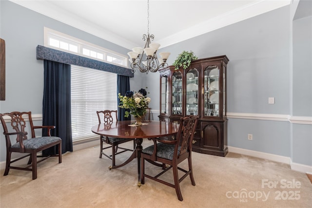 carpeted dining room with crown molding and an inviting chandelier