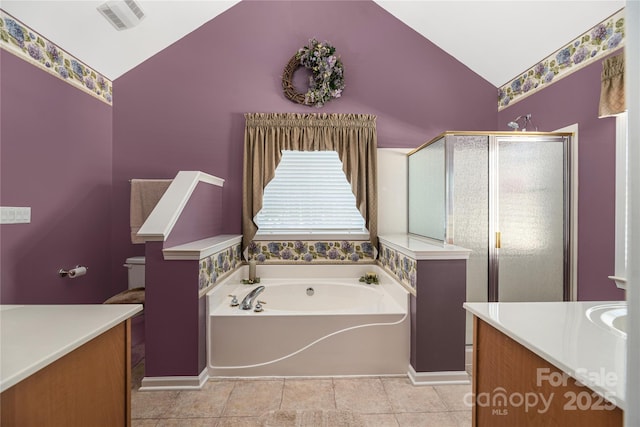 bathroom with vanity, vaulted ceiling, and independent shower and bath